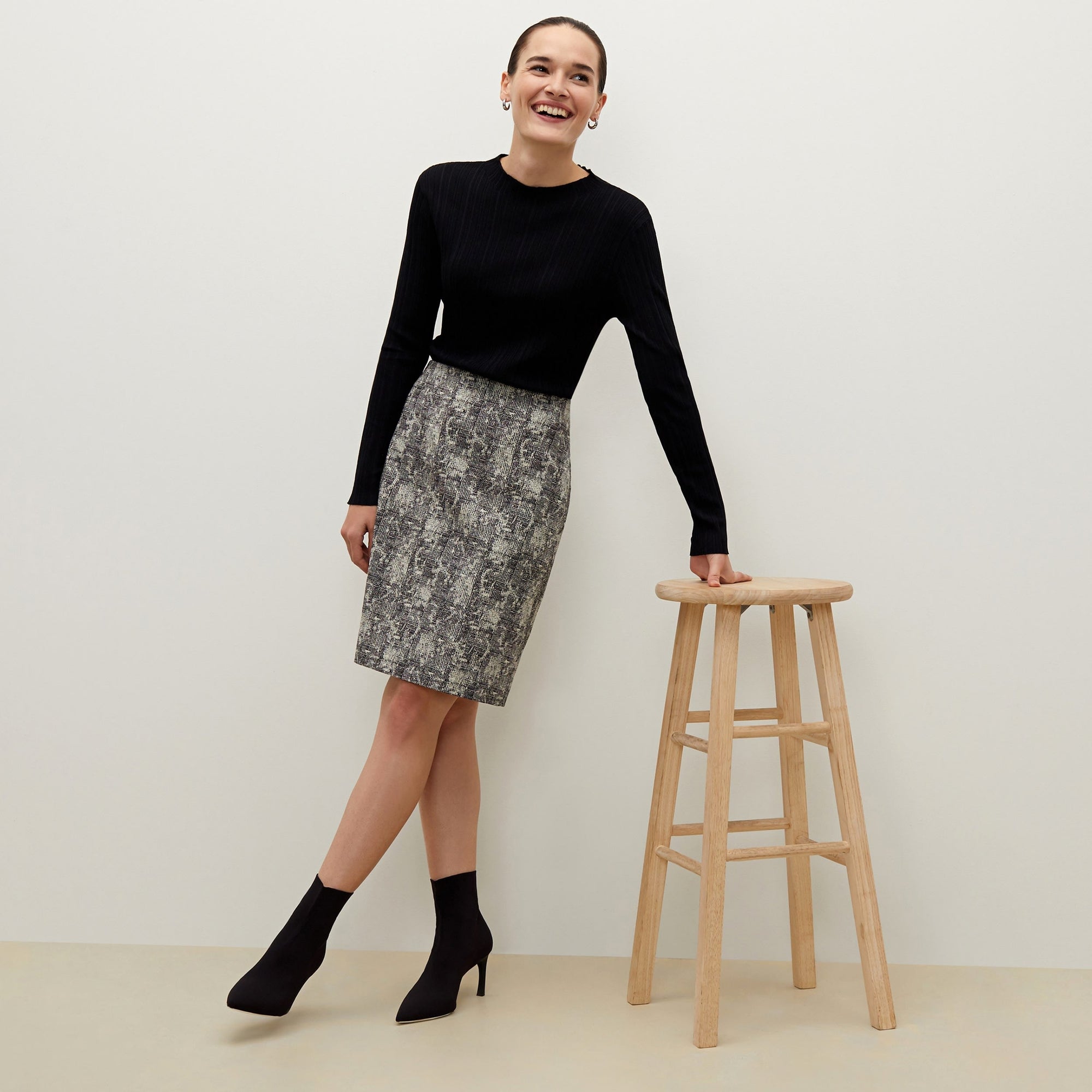 Detail image of a woman standing wearing the Noho skirt in crackle