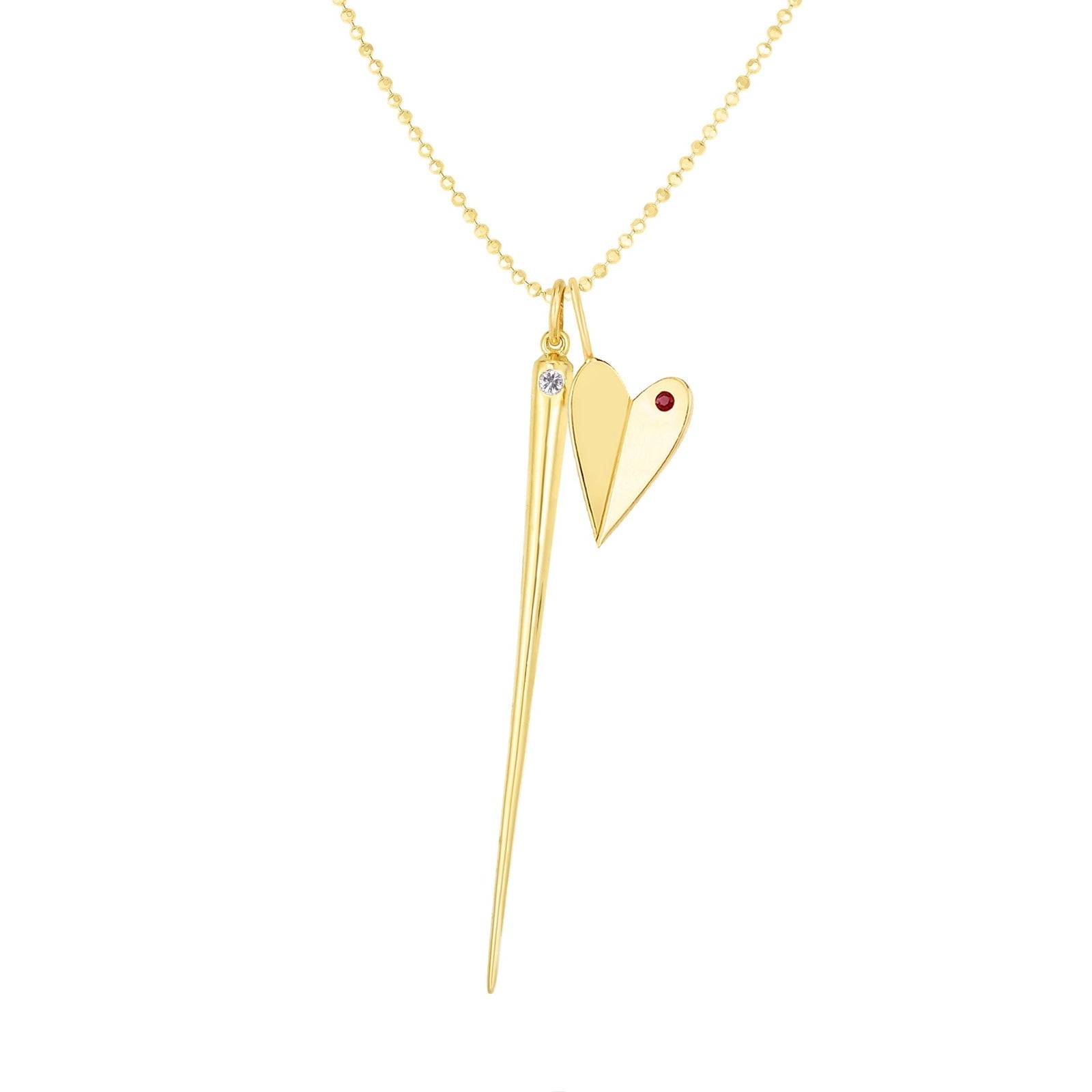14K Gold Folded Heart Charm with garnet styled with quill spike charm and chain on white background
