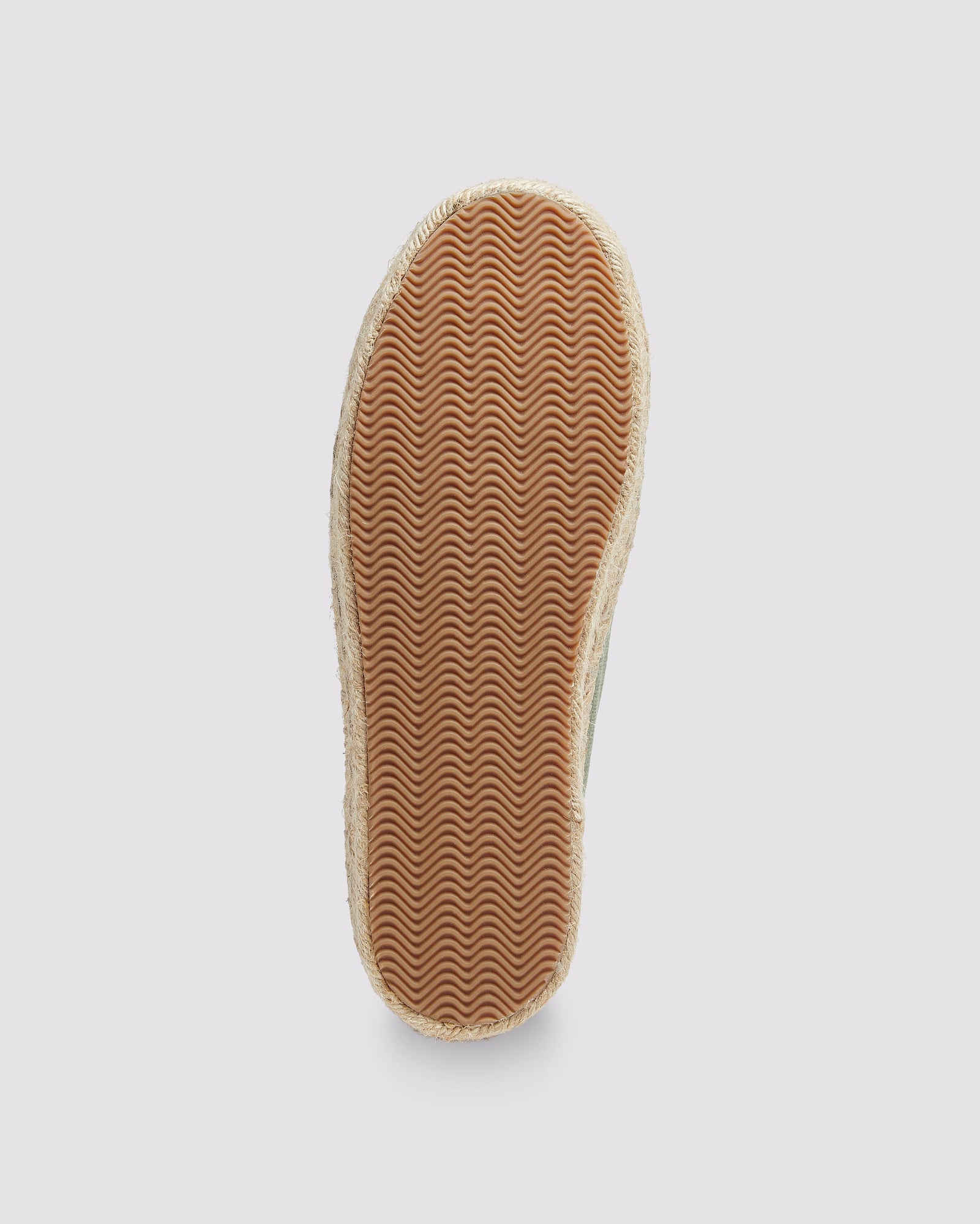 Bottom view of P448 green canvas sneaker showcasing the organic jute sole with amber rubber tread for grip and durability.