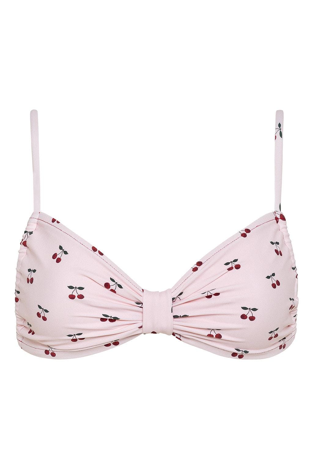 Pink bikini top with red and black cherry print, twisted center detail, and thin shoulder straps.