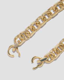 Close up of necklace clasp open on grey background. 