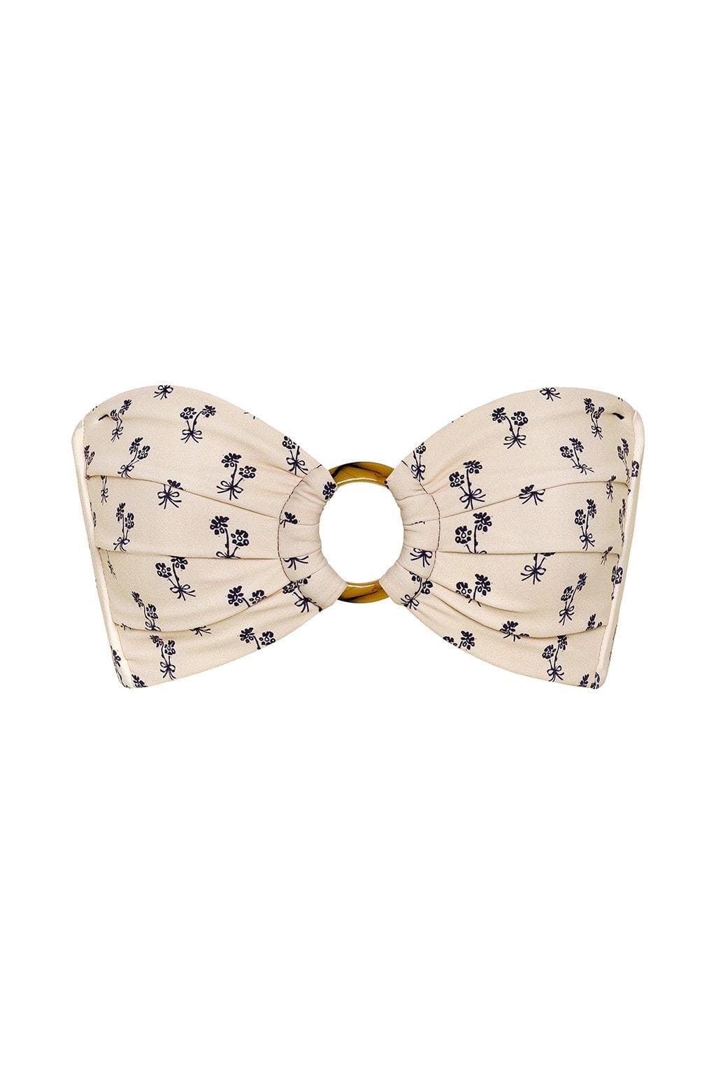 Cream bandeau bikini top with black floral print and gold ring center detail.