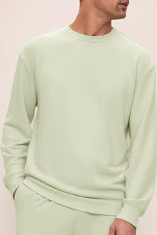 Model is wearing French Terry Sweatshirt in Matcha