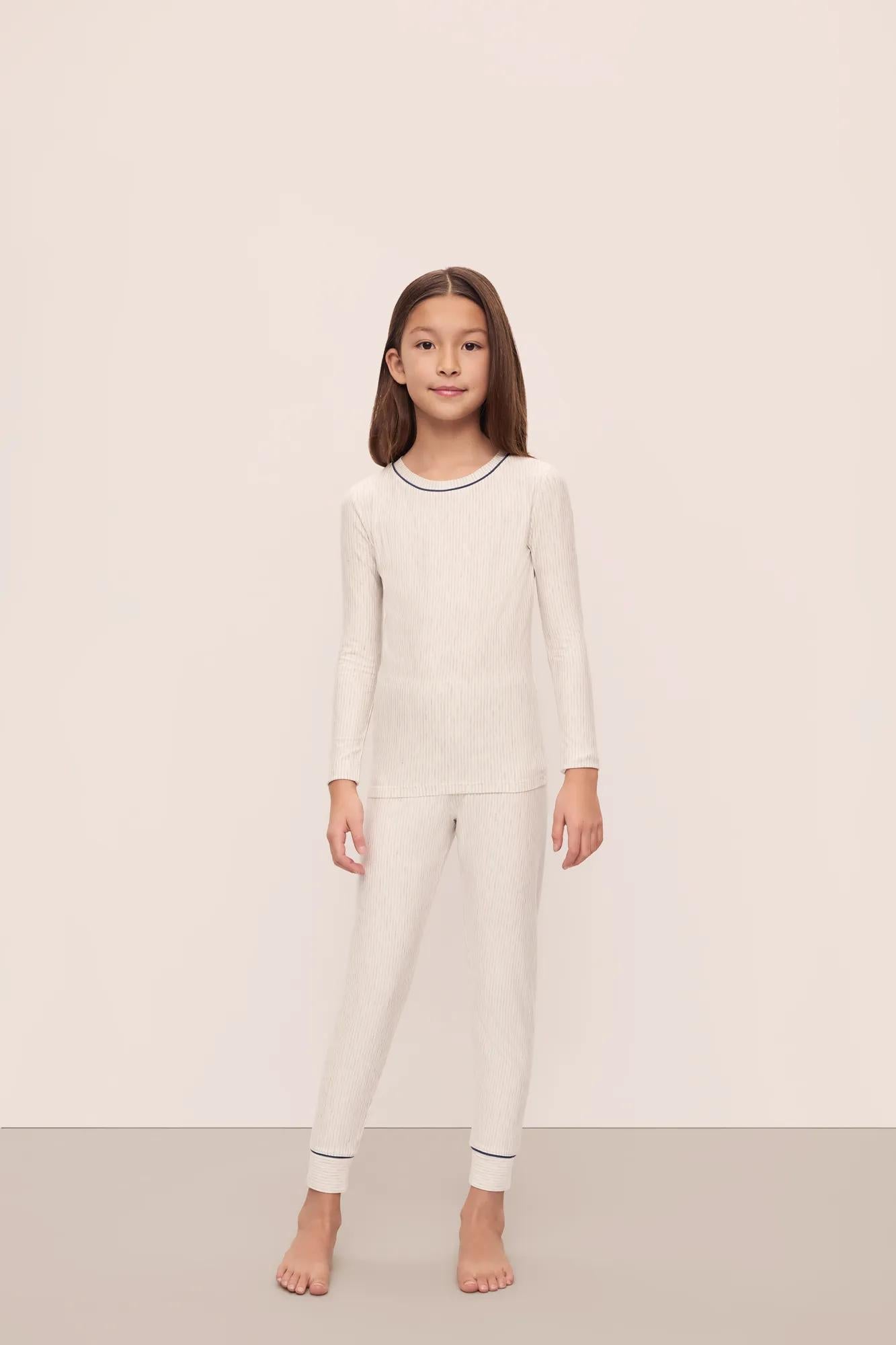 Model is wearing Kids Printed TENCEL Modal Unisex Long PJ Set in Heritage Stripe Light Heather Grey/Peppercorn