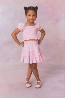 Pink gingham three tiered ruffle skirt, with elastic waistband for girls.