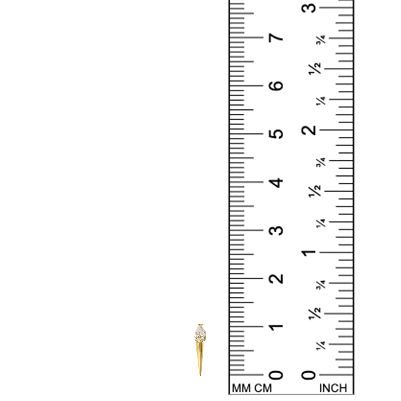 diamond with spike stud earring next to ruler