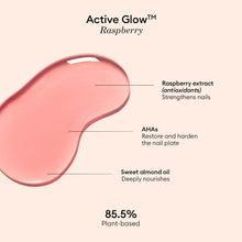 Active™ Glow Raspberry by Manucurist is a pink liquid swatch formulated with raspberry extract (to strengthen nails), AHAs (to restore and harden), and sweet almond oil (to nourish) for ultimate nail nourishment. The text highlights its 85.5% plant-based formula, emphasizing a clean, minimal approach to nail care against a simple background.