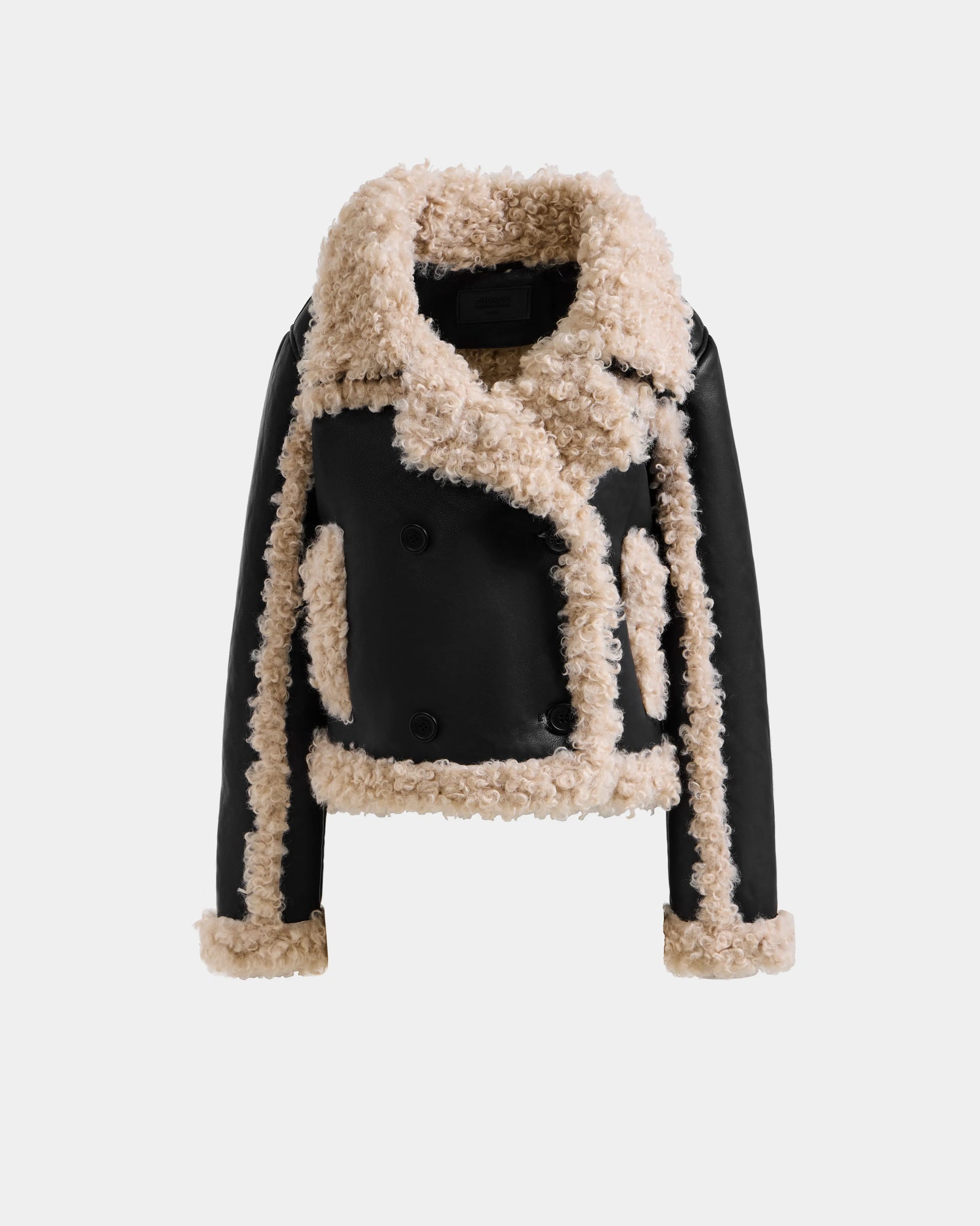 The Rudsak EMERY - L125548 Black is a cropped vegan-leather jacket with beige faux shearling trim on the collar, cuffs, hem, and seams, shown against a plain white background.