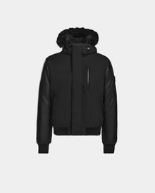The Rudsak DERON - M123517 BLACK is a mens bomber jacket featuring a front zip, ribbed cuffs and hem, chest zipper pocket, fur-lined hood, and weather-resistant fabric, shown against a plain white background.