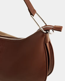 Close-up of the Rudsak SYLVIA - L325515 Mocha women's leather shoulder bag, featuring a crescent silhouette, silver zipper, metal handle attachments, and showcasing its fine texture and stitching details.