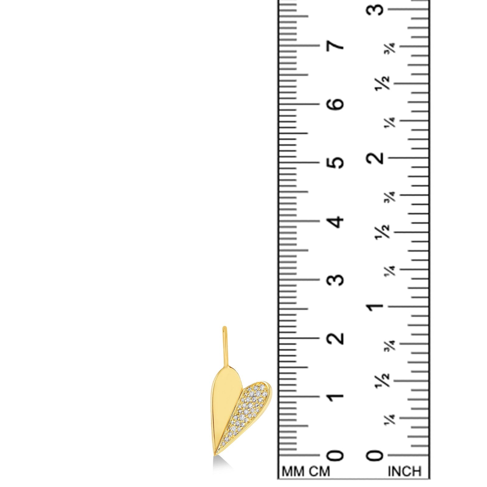 14k recycled gold Folded Heart Charm with diamond pavé on a white background with a ruler