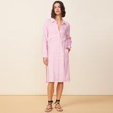 Front view of model wearing the linen shirt dress in bubblegum.