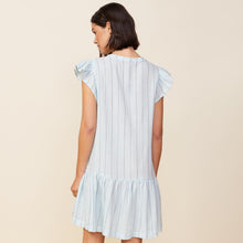 Back view of model wearing the pinstripe gauze easy ruffle dress in sea foam.