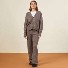 Front view of model in the marled oversized cardigan in black sesame.