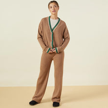 Front view of model wearing the sweater rib oversized cardigan in camel.