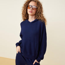 Front view of model wearing the supersoft fleece slouchy pullover in navy.