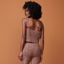 Back view of model wearing the marled tank in pomegranate.