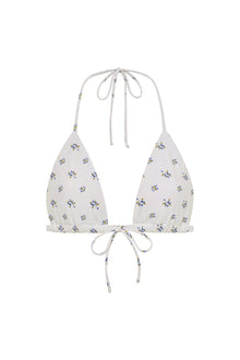White triangle bikini top with small blue and yellow floral print throughout, adjustable halter and side tie straps.