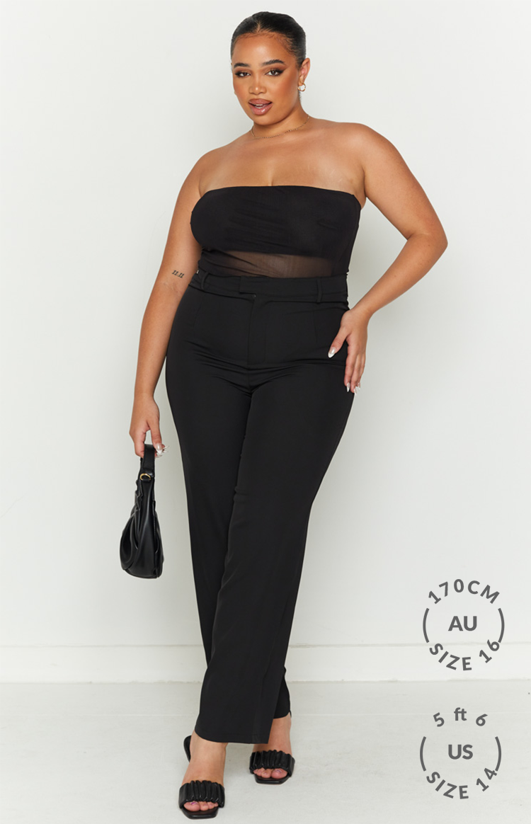 Front view of a black strapless bandeau top with a sheer mesh body