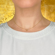 14k recycled gold Stitch Necklace styled on a neck