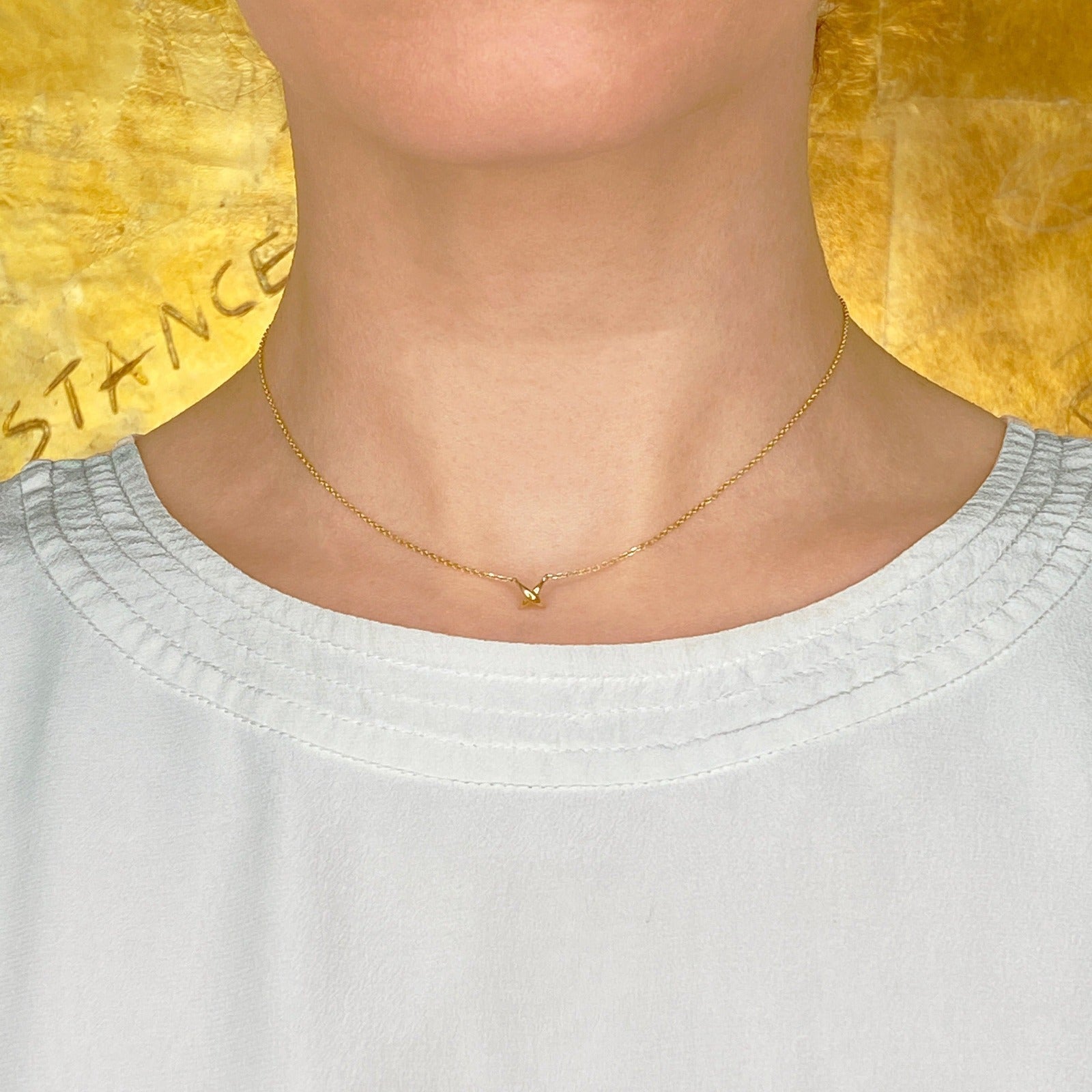 14k recycled gold Stitch Necklace styled on a neck