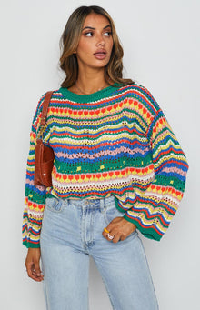 Multi-coloured striped open knit sweater with a green ribbed crew neck and long balloon sleeves