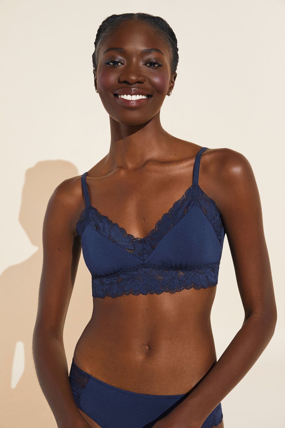 Model wears Rosalia TENCEL Modal Bralette in Navy.