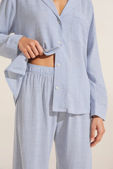 Model is wearing Nautico Long PJ Set in Wedgewood Blue/White.