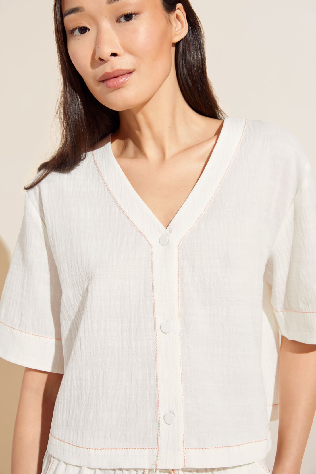 Model wears Crinkle Woven Short Sleeve Top & Short Set in Ivory/Canyon Sunset.