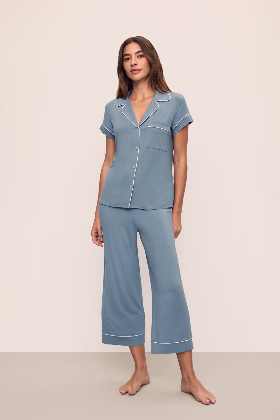 Model is wearing Gisele TENCEL Modal Short Sleeve Cropped PJ Set in Faded Denim/Ivory