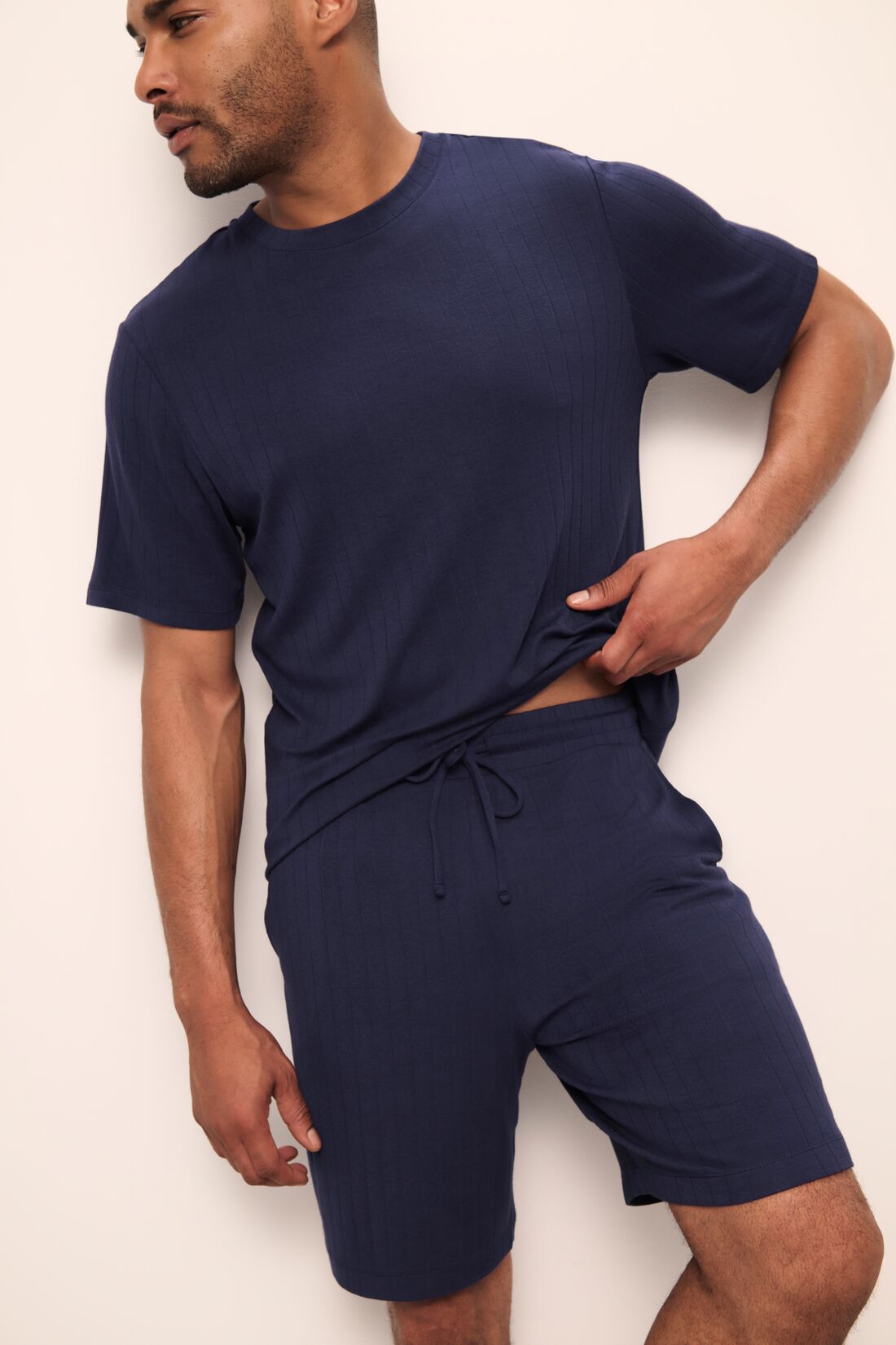 Model wears Henry TENCEL Modal Rib Short PJ Set in True Navy.