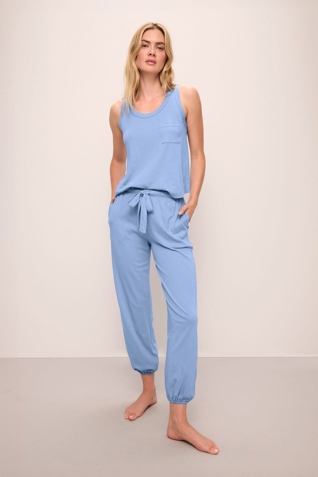 Model wears the Aloe Cotton Pant in Wedgewood Blue.