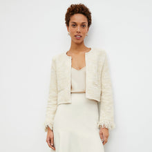 Front image of a woman standing wearing the lilia jacket in black and white | Lead