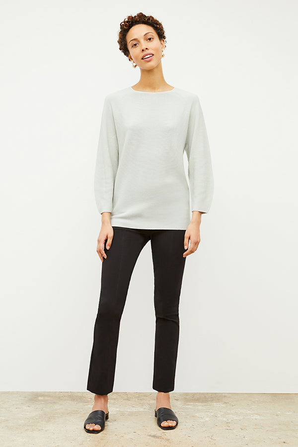 Front image of a woman standing wearing the Foster Pant—Everstretch in Black | Exclude