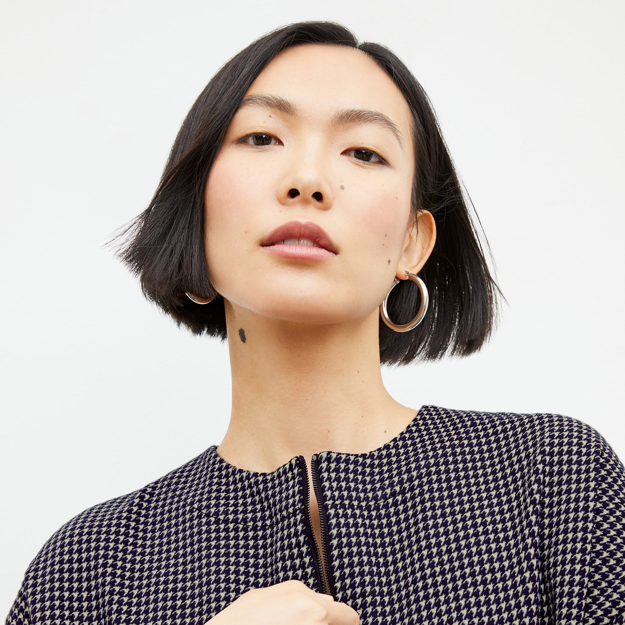 Front image of a woman wearing the tully top in black and white