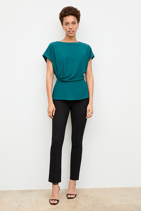 Front image of a woman standing wearing the Foster Pant—Everstretch in Black | Exclude