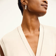 front image of a woman wearing the toula dress in ivory