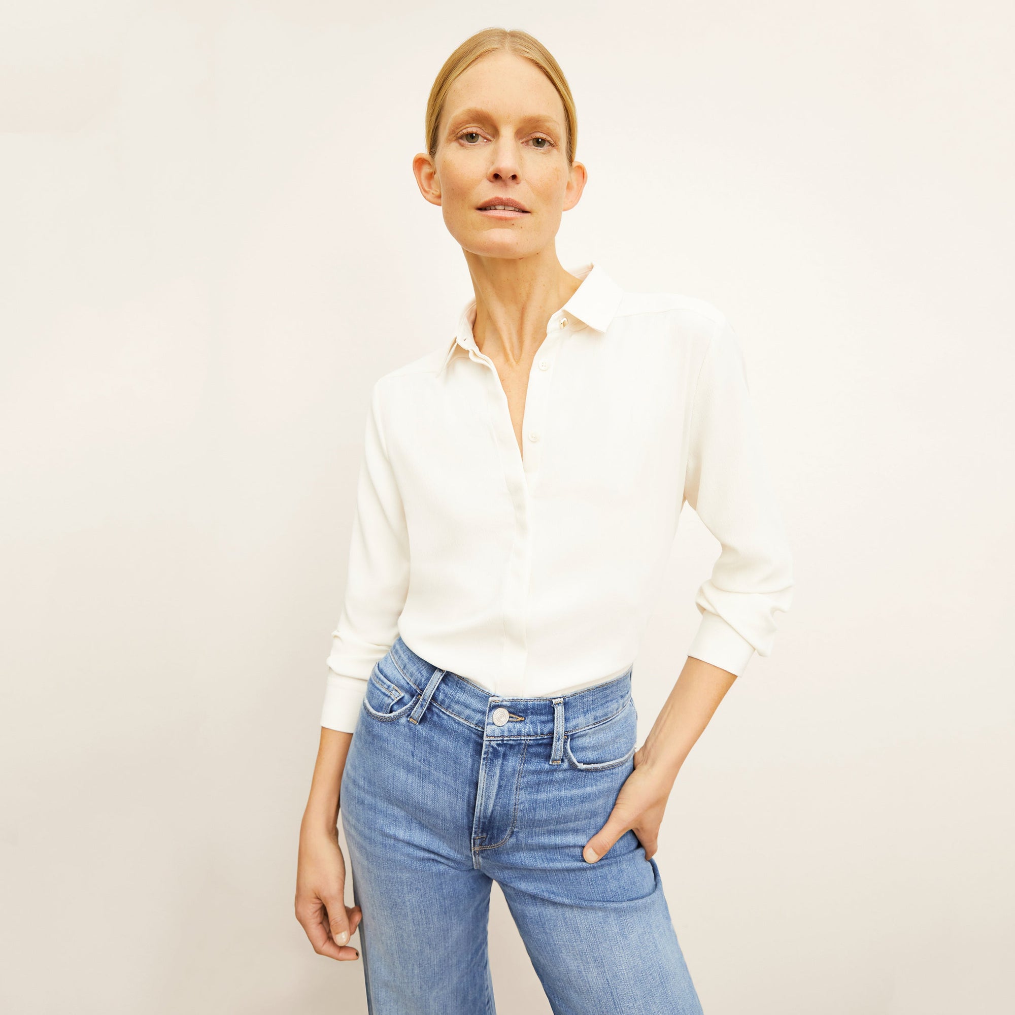 Front image of a woman standing wearing the Lagarde Shirt—Soft Wave in Alabaster 