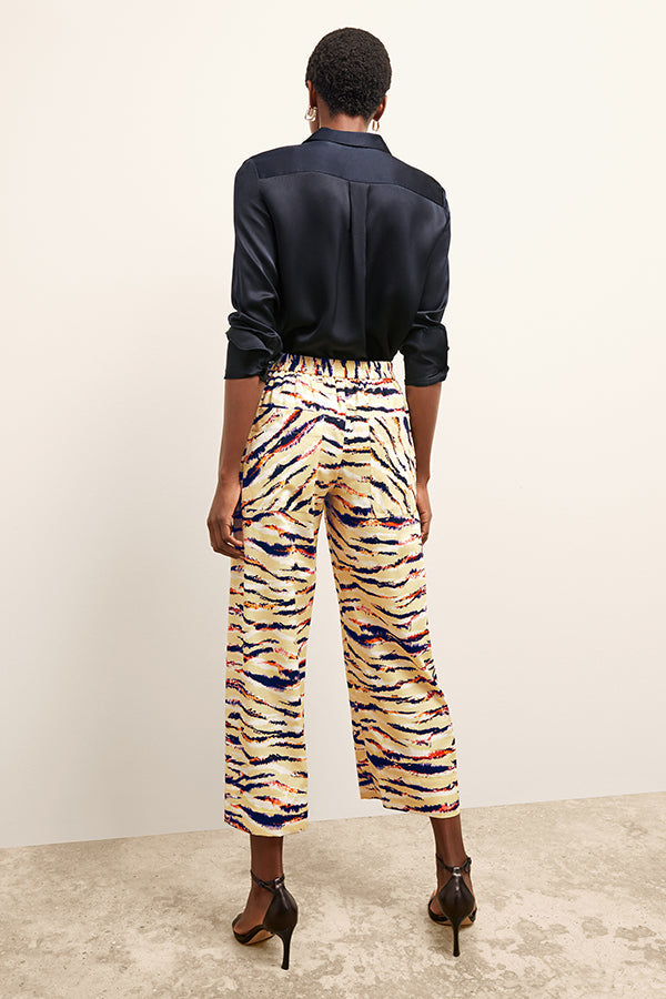 front image of a woman wearing the madelyn pant in savannah print | Exclude