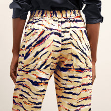 back detail image of a woman wearing the madelyn pant in savannah print