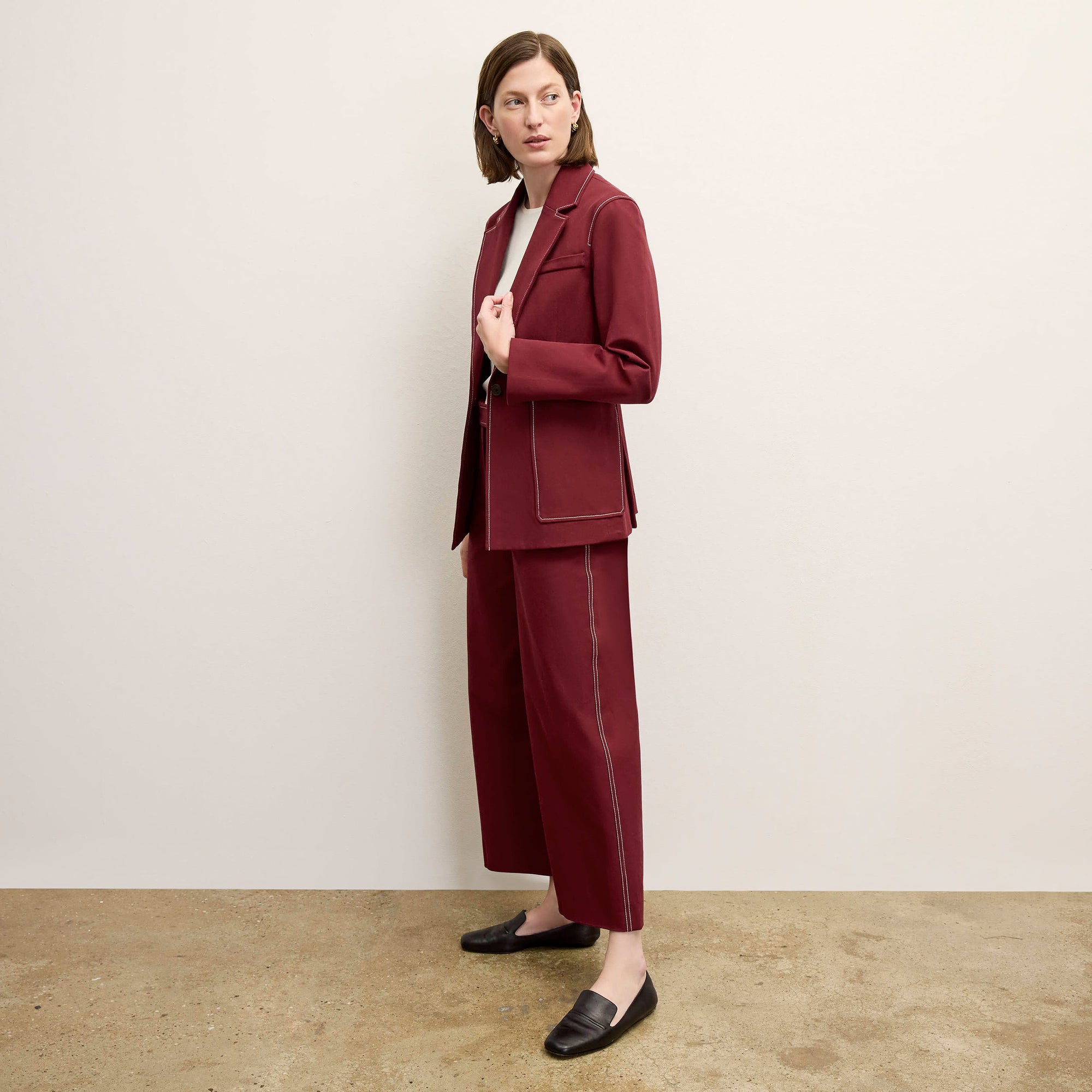 front image of a woman wearing the abby pant in berry jam 