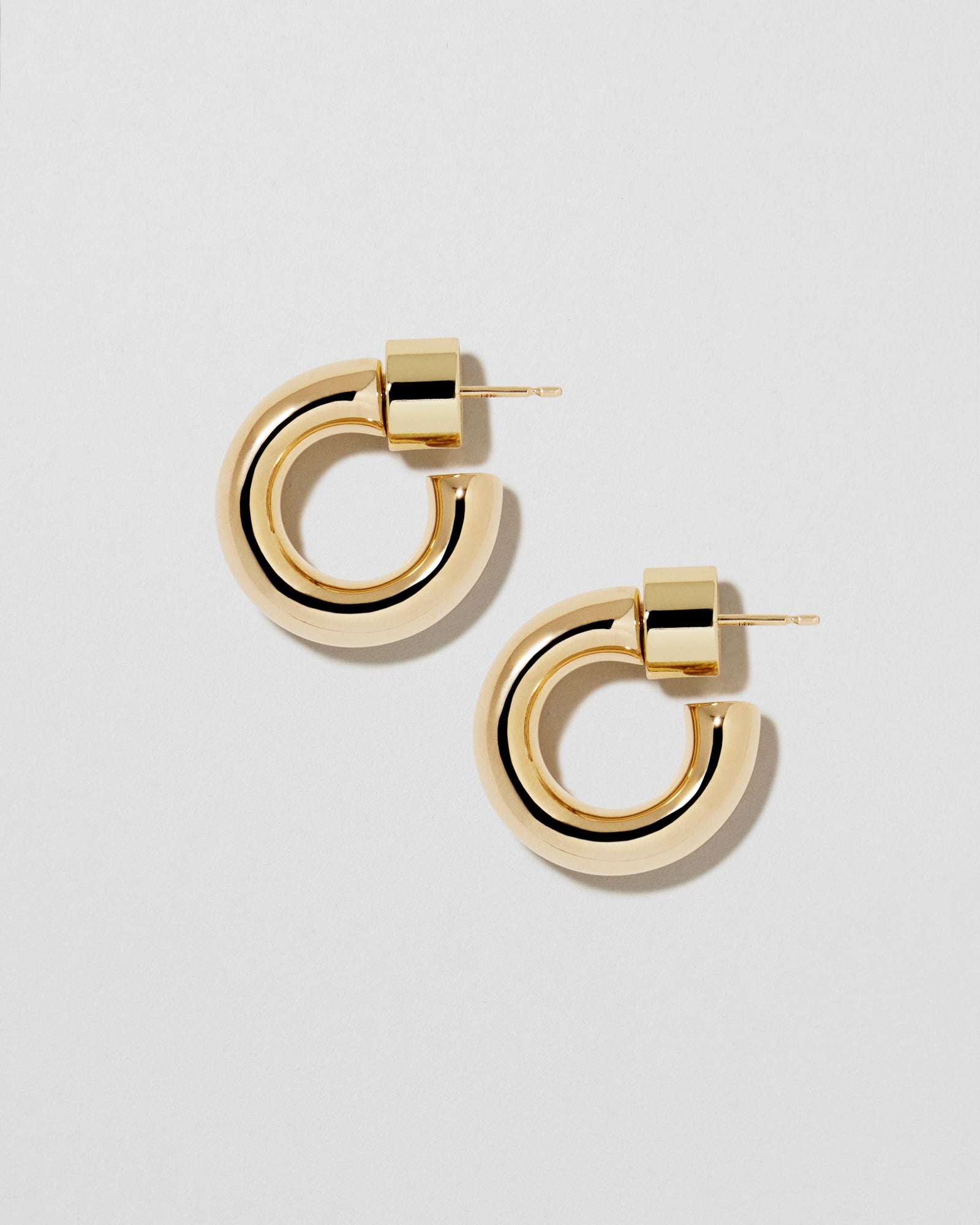 Natasha Micro Huggies earring - styled on model | gold huggie earrings