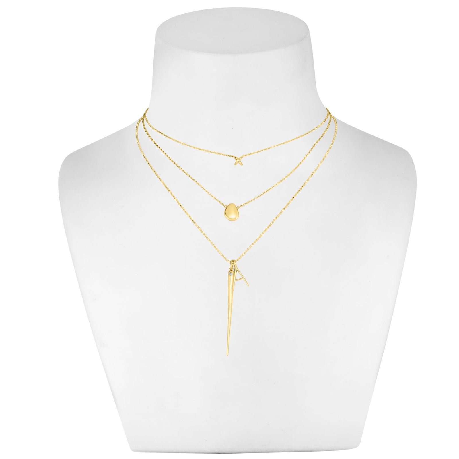 14k recycled gold Stitch Necklace with lobster clasp with extendable jump rings on a white bust styled with multiple chains and charms