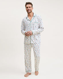 Men's Pima Pajama Set in Merry Meow: white set with green piping, featuring an all-over print of playful colorful cats. Includes a long-sleeve button-up shirt with chest pocket and matching pants.