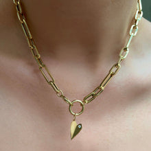 14K Gold Folded Heart Charm with white diamond on neck styled with charm lock and chain