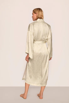Model is wearing Inez Washable Silk Printed Robe in Foliage Mint Cream