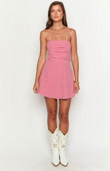 Red gingham mini dress featuring a square neckline, thin spaghetti straps, and a ruched bodice