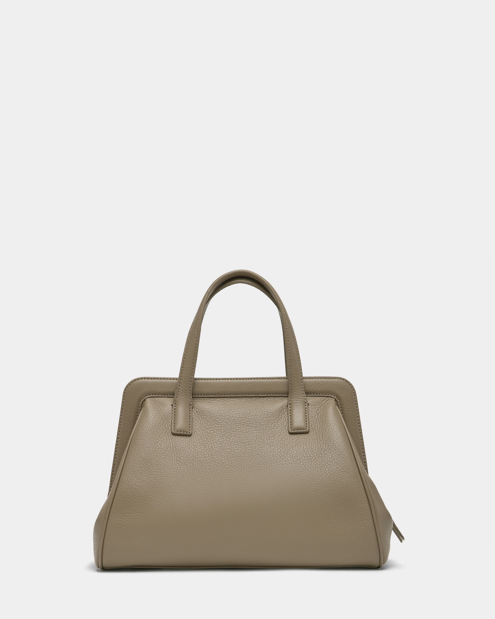 The Rudsak TAULLA - 8325002 Almond is a women’s satchel in taupe pebble leather with two top handles, a structured rectangular shape, minimal design, and roomy interior, shown against a white background.