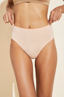 Model wears Pima Stretch Cotton Highwaist Brief in Buff.