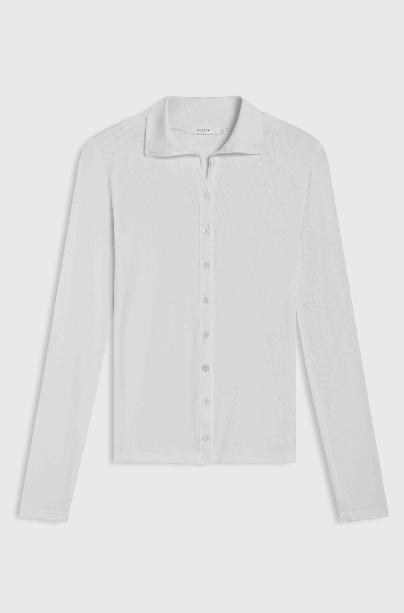 White button up shirt against a light grey background